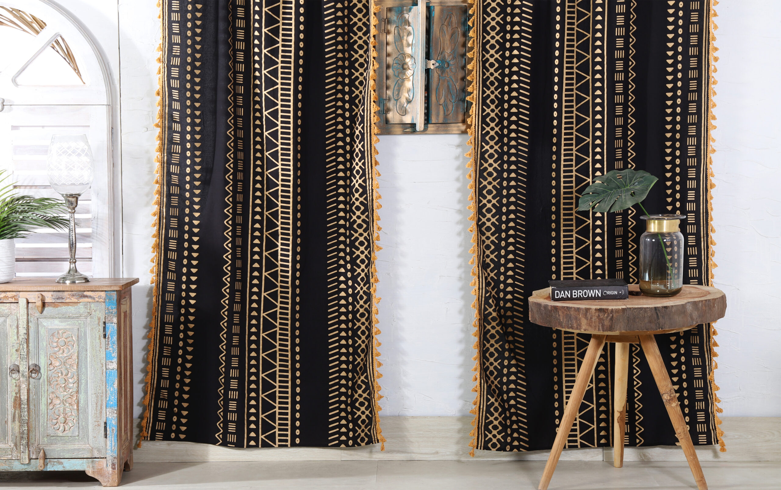 Ethnic home décor tapestry displayed in a room